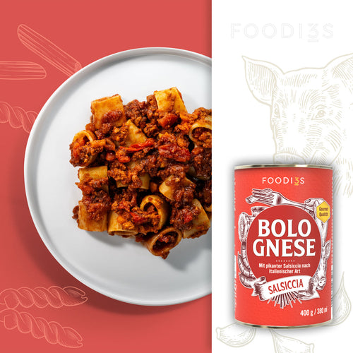 Bolognese Salsiccia: plate of short tube pasta with Bolognese, the red can beside it